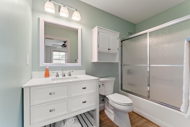 8 Studley Ln, Wells, ME 04090 - full bath with vanity, wood finished floors, combined bath / shower with glass door, and a ceiling fan