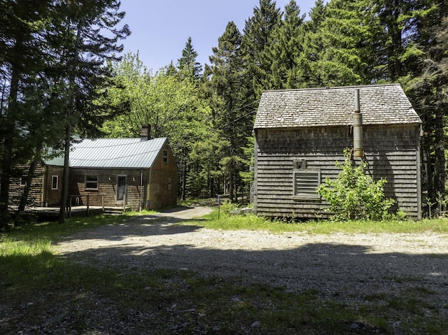 30 Wilkinson Ln, Machiasport, ME 04655 - view of yard with an outbuilding and a wooded view