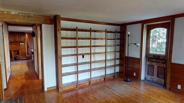 30 Wilkinson Ln, Machiasport, ME 04655 - entryway with a large fireplace, wood finished floors, and wooden walls