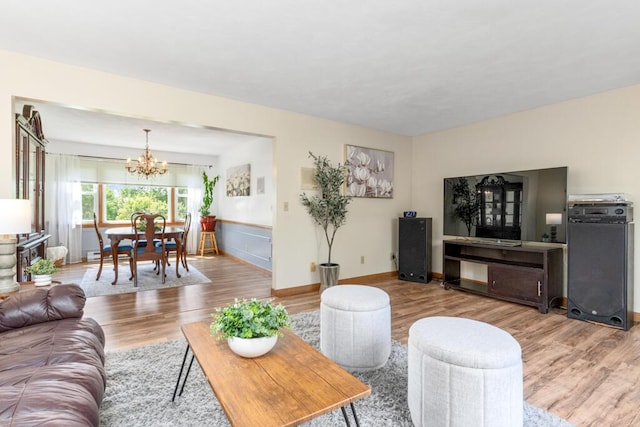 470 Main St, Waterville, ME 04901 - living area with a chandelier and wood finished floors