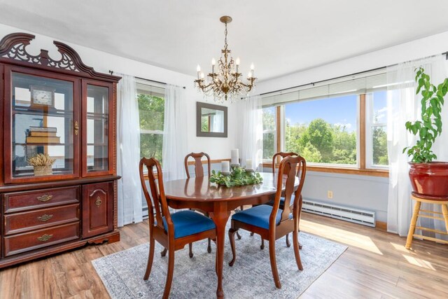 470 Main St, Waterville, ME 04901 - dining area featuring a baseboard radiator, a chandelier, and light wood finished floors