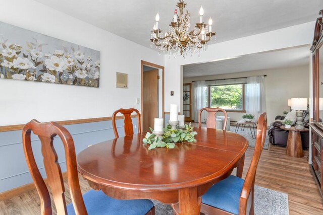 470 Main St, Waterville, ME 04901 - dining space with light wood-type flooring and a chandelier