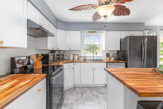 470 Main St, Waterville, ME 04901 - kitchen featuring wood counters, appliances with stainless steel finishes, under cabinet range hood, and a ceiling fan
