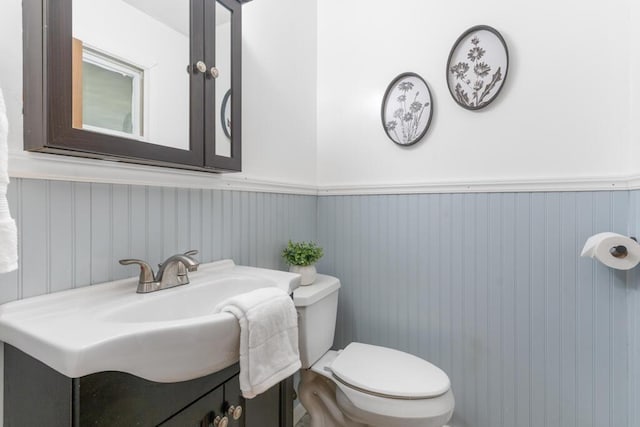 470 Main St, Waterville, ME 04901 - half bath with vanity and a wainscoted wall