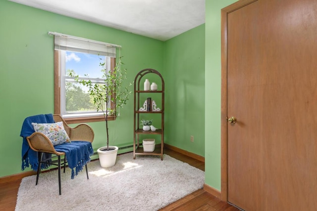 470 Main St, Waterville, ME 04901 - living area featuring wood finished floors and baseboard heating