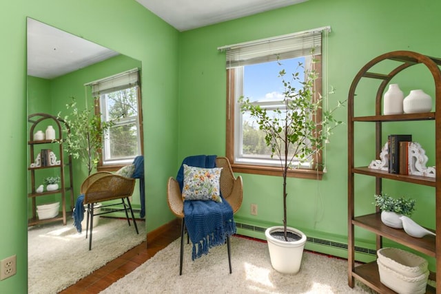 470 Main St, Waterville, ME 04901 - living area featuring wood finished floors and a baseboard heating unit