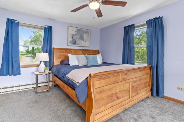 470 Main St, Waterville, ME 04901 - carpeted bedroom featuring a baseboard radiator and ceiling fan