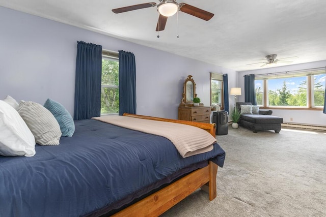 470 Main St, Waterville, ME 04901 - carpeted bedroom featuring a baseboard radiator and ceiling fan