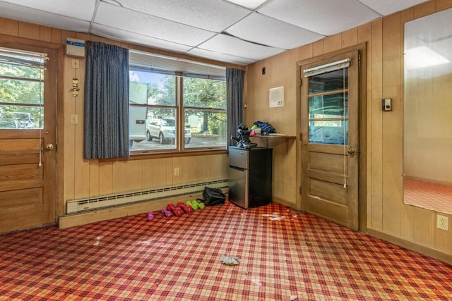 470 Main St, Waterville, ME 04901 - entryway featuring baseboard heating, carpet floors, and wooden walls