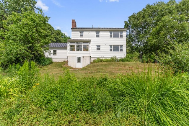 470 Main St, Waterville, ME 04901 - rear view of property featuring a chimney and a metal roof