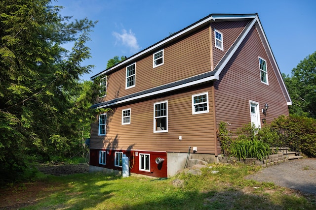 38 Swamp Rd, Bridgton, ME 04009 - rear view of house with a lawn