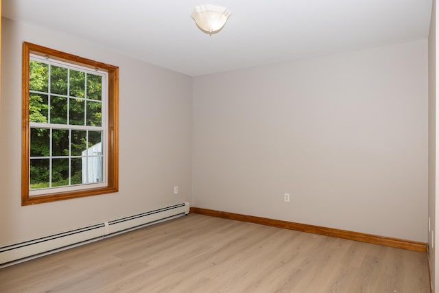 38 Swamp Rd, Bridgton, ME 04009 - unfurnished room with a baseboard heating unit and light wood-type flooring