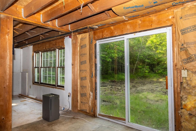 38 Swamp Rd, Bridgton, ME 04009 - doorway to outside featuring healthy amount of natural light and unfinished concrete floors