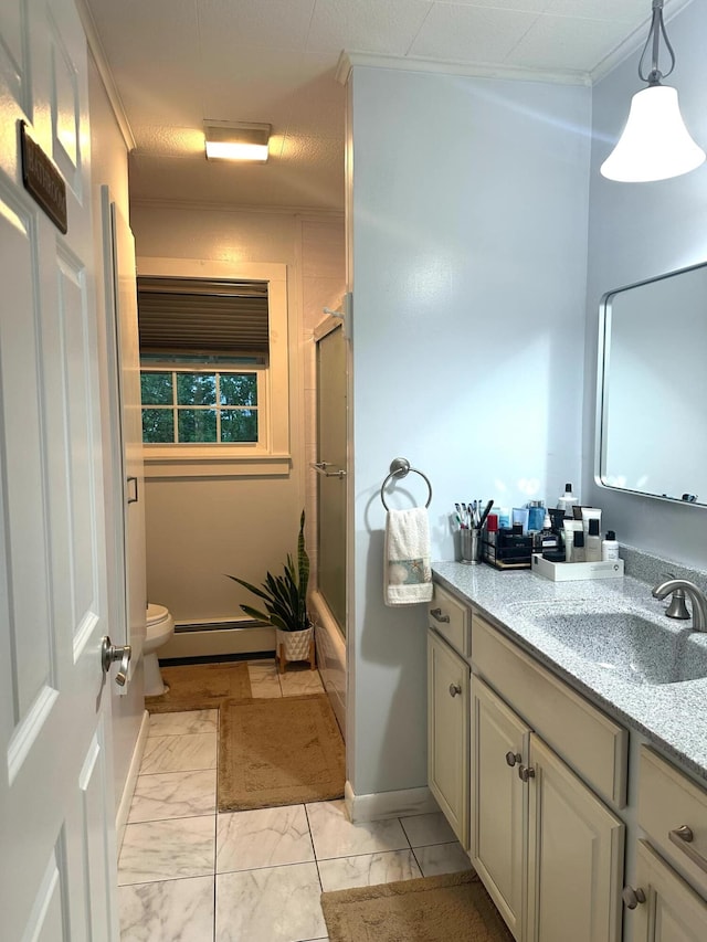 7 Lorraine Ave, Lewiston, ME 04240 - bathroom with vanity, marble finish flooring, baseboard heating, crown molding, and enclosed tub / shower combo