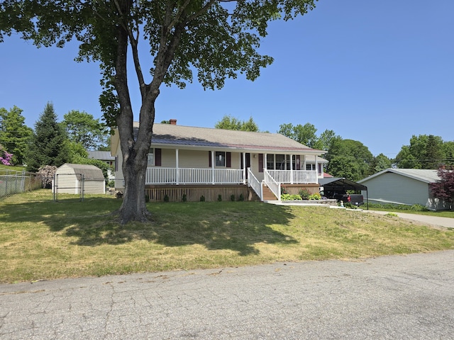 7 Lorraine Ave, Lewiston, ME 04240 - ranch-style home with a detached carport, a porch, a chimney, and a shed