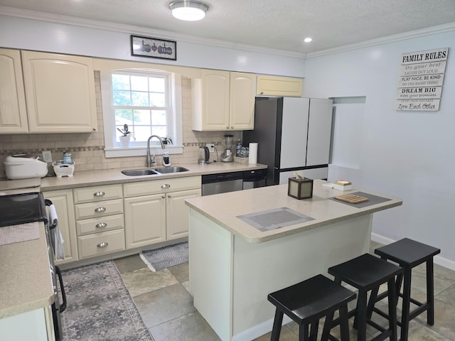 7 Lorraine Ave, Lewiston, ME 04240 - kitchen featuring stainless steel appliances, a kitchen bar, tasteful backsplash, crown molding, and light countertops