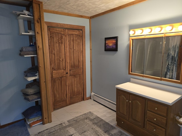 502 Cedar Lake Rd, Millinocket, ME 04462 - bathroom featuring baseboard heating, marble finish flooring, and vanity