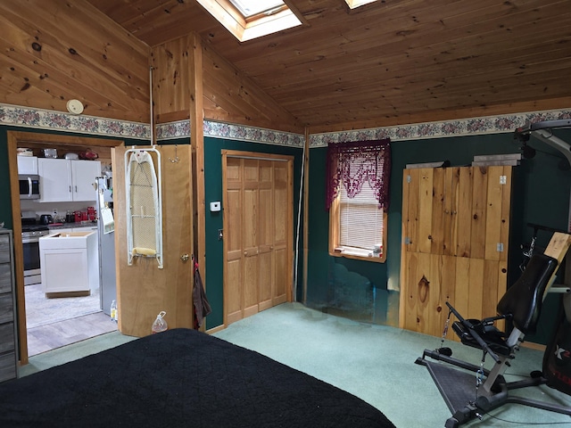 502 Cedar Lake Rd, Millinocket, ME 04462 - bedroom with wooden ceiling, light carpet, a skylight, and lofted ceiling