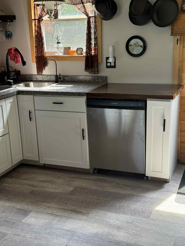 502 Cedar Lake Rd, Millinocket, ME 04462 - kitchen with dishwasher, dark countertops, white cabinetry, and light wood-style flooring