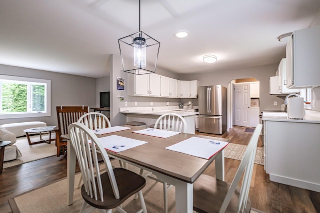 111 Rocky Rd, Woodstock, ME 04219 - dining area with arched walkways, dark wood-style flooring, and recessed lighting