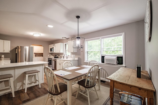 111 Rocky Rd, Woodstock, ME 04219 - dining space featuring cooling unit, dark wood-style floors, recessed lighting, and washer and clothes dryer