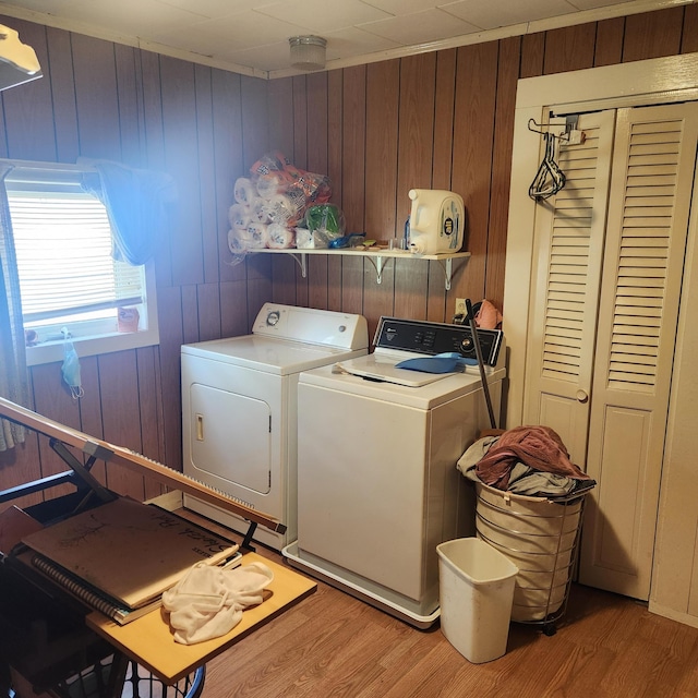 485 Main Rd, Passadumkeag, ME 04475 - laundry area featuring washing machine and clothes dryer, light wood-type flooring, and wood walls