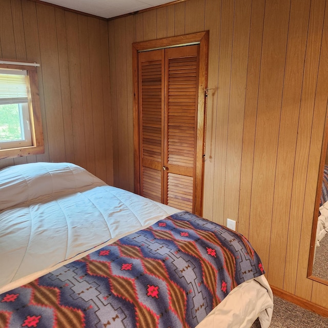 485 Main Rd, Passadumkeag, ME 04475 - bedroom with wood walls and carpet floors
