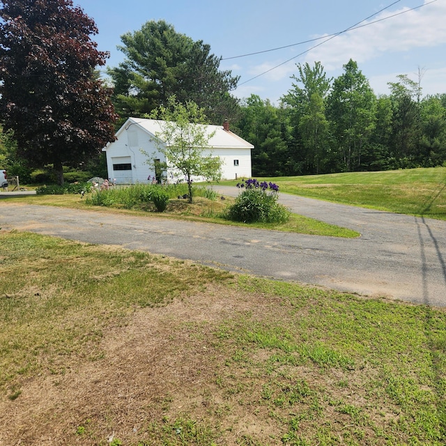 485 Main Rd, Passadumkeag, ME 04475 - view of side of property with a garage and a lawn