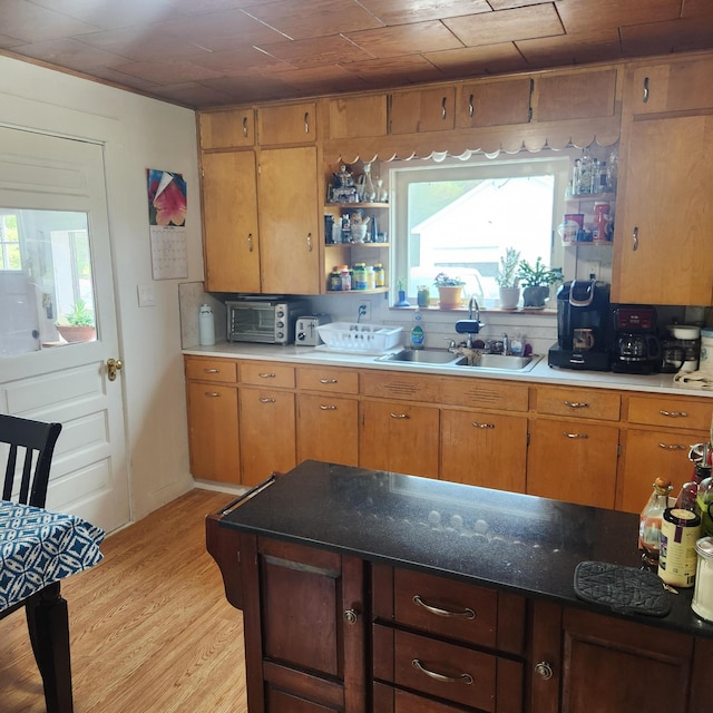 485 Main Rd, Passadumkeag, ME 04475 - kitchen featuring light wood-type flooring, open shelves, and brown cabinetry