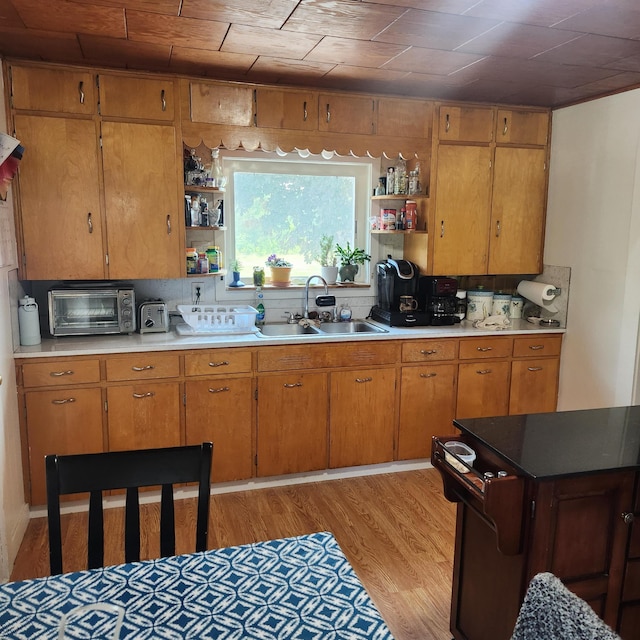 485 Main Rd, Passadumkeag, ME 04475 - kitchen featuring open shelves, light wood-style flooring, brown cabinetry, and light countertops