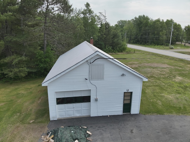 485 Main Rd, Passadumkeag, ME 04475 - detached garage featuring a forest view
