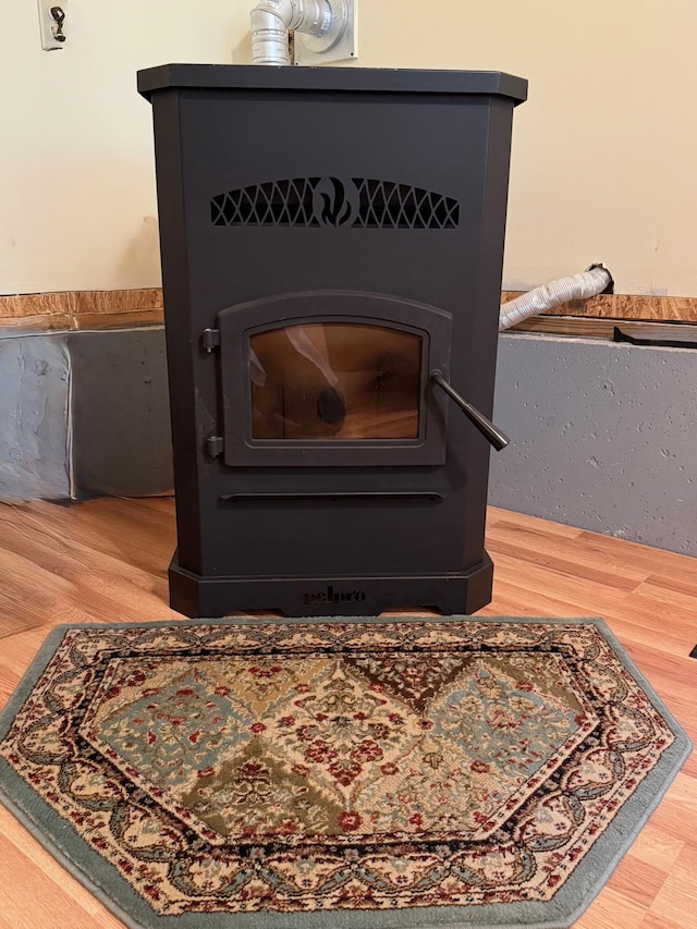 49 31st St, Shapleigh, ME 04076 - detailed view of wood finished floors and a wood stove