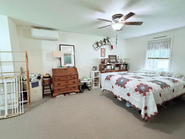 49 31st St, Shapleigh, ME 04076 - carpeted bedroom with a wall mounted AC and a ceiling fan
