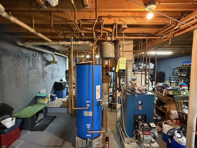 49 31st St, Shapleigh, ME 04076 - utility room with gas water heater and a heating unit