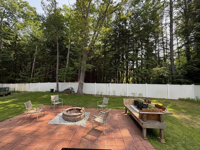 49 31st St, Shapleigh, ME 04076 - fenced backyard with a fire pit and a patio area