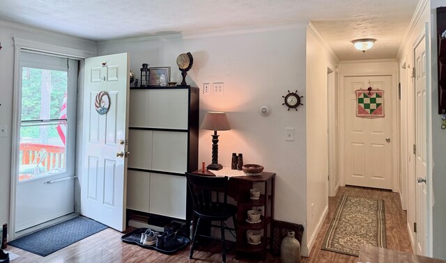 49 31st St, Shapleigh, ME 04076 - foyer entrance featuring wood finished floors and crown molding