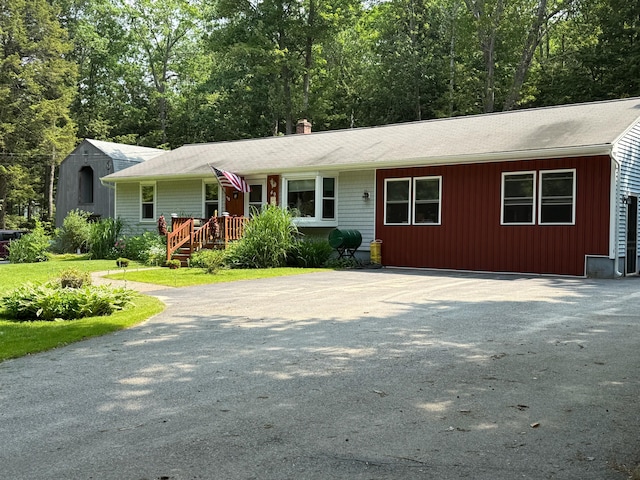 49 31st St, Shapleigh, ME 04076 - ranch-style home featuring a chimney, a shingled roof, and driveway