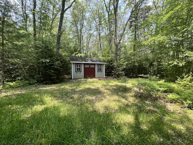 20 Lemeuls Rd, Bristol, ME 04558 - view of yard with a storage unit and a view of trees
