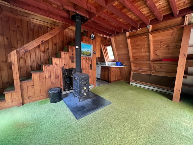20 Lemeuls Rd, Bristol, ME 04558 - unfurnished office with carpet flooring, a wood stove, wooden walls, and beamed ceiling
