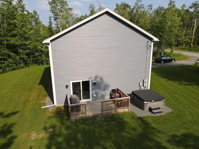 34 May Way, Sidney, ME 04330 - back of property featuring a lawn, a wooden deck, and a view of trees