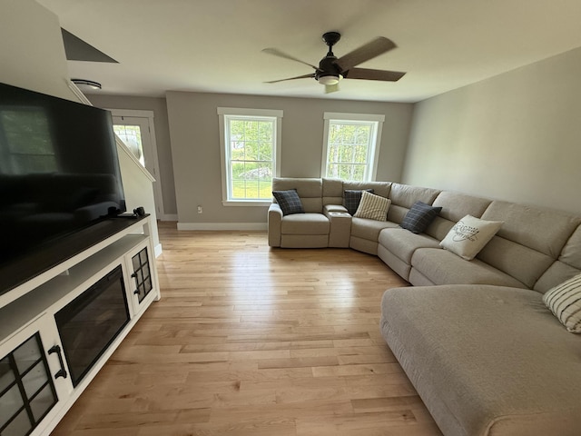 34 May Way, Sidney, ME 04330 - living area with light wood-style floors and ceiling fan