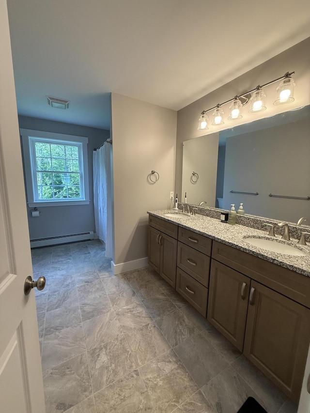 34 May Way, Sidney, ME 04330 - full bathroom featuring double vanity and a baseboard heating unit