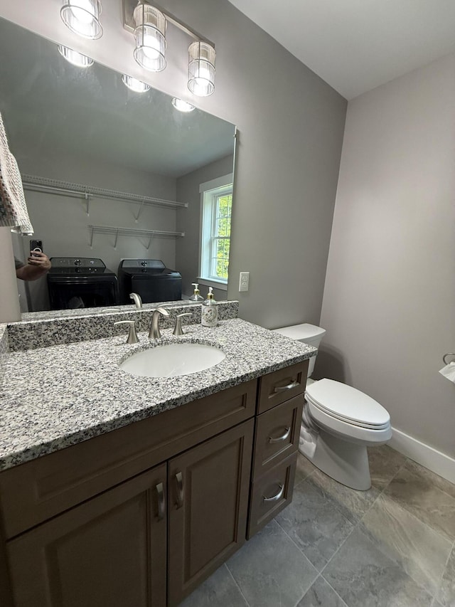 34 May Way, Sidney, ME 04330 - bathroom with washing machine and clothes dryer and vanity
