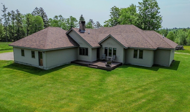 32 Ridge Rd, Marshfield, ME 04654 - back of property with roof with shingles, a chimney, a lawn, and a deck