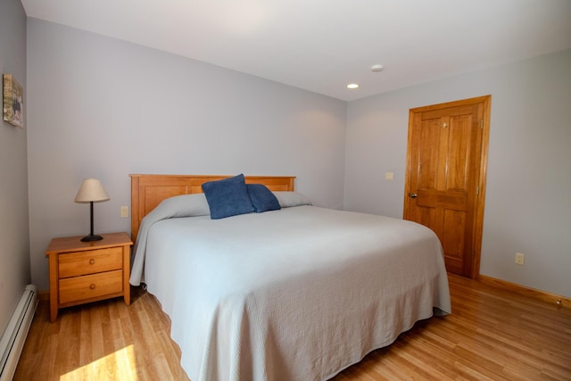 32 Ridge Rd, Marshfield, ME 04654 - bedroom featuring a baseboard radiator, light wood-type flooring, and recessed lighting