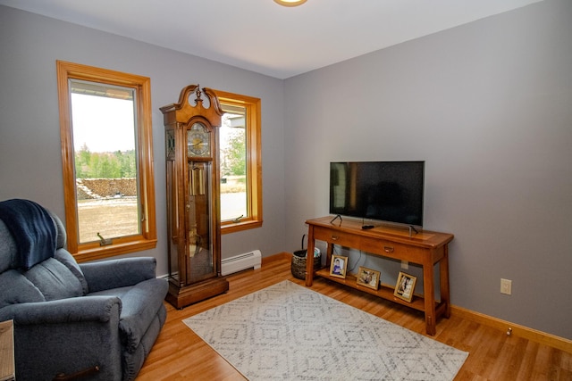 32 Ridge Rd, Marshfield, ME 04654 - living area featuring baseboard heating and light wood-style floors