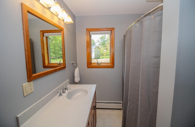 32 Ridge Rd, Marshfield, ME 04654 - full bathroom featuring a baseboard heating unit, healthy amount of natural light, and vanity