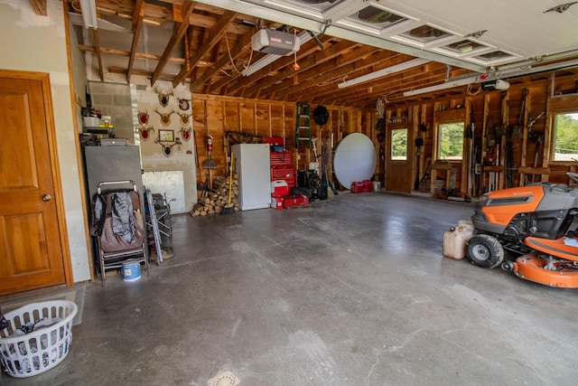 32 Ridge Rd, Marshfield, ME 04654 - garage featuring a garage door opener