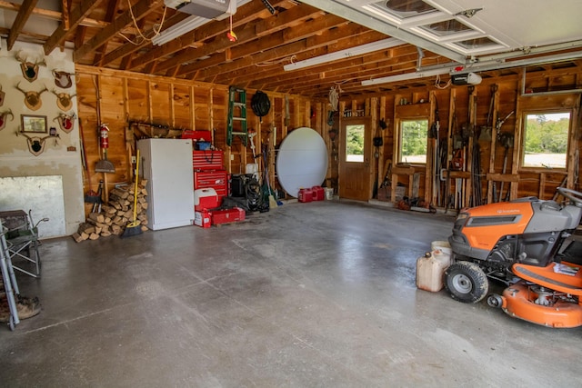 32 Ridge Rd, Marshfield, ME 04654 - garage featuring a garage door opener