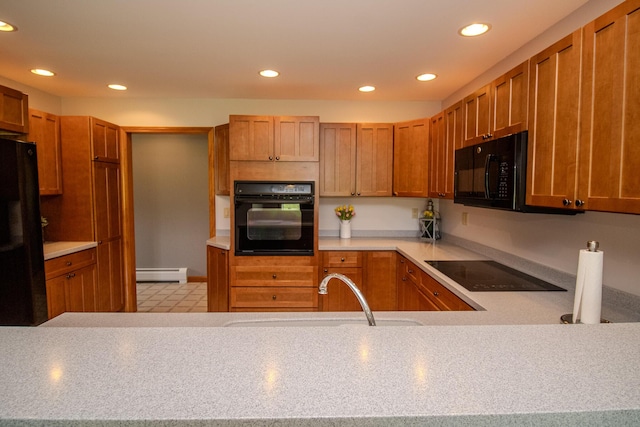32 Ridge Rd, Marshfield, ME 04654 - kitchen featuring black appliances, baseboard heating, recessed lighting, light countertops, and brown cabinetry